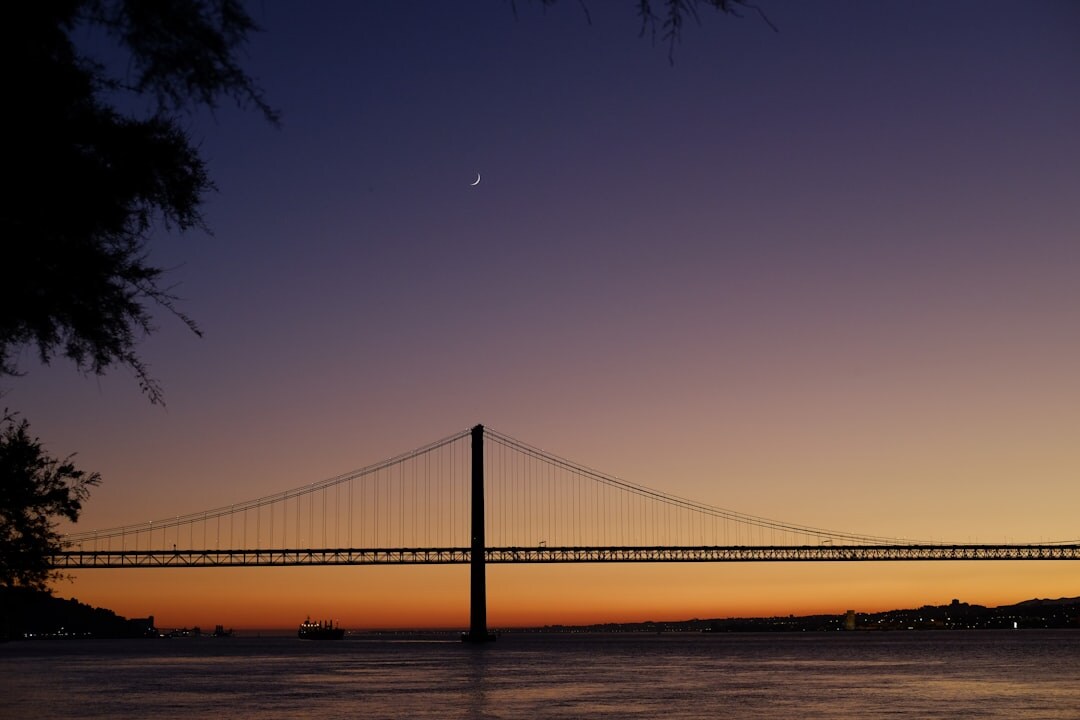 Lisbon skyline at dusk with the Tagus river and colorful buildings