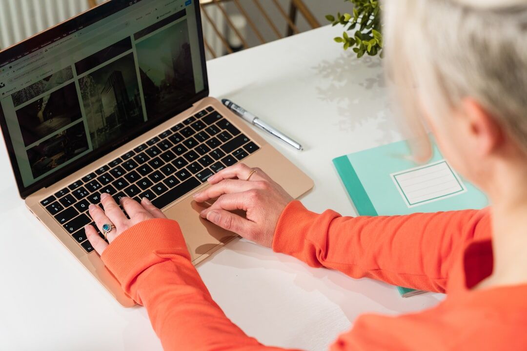 blogger coding on laptop