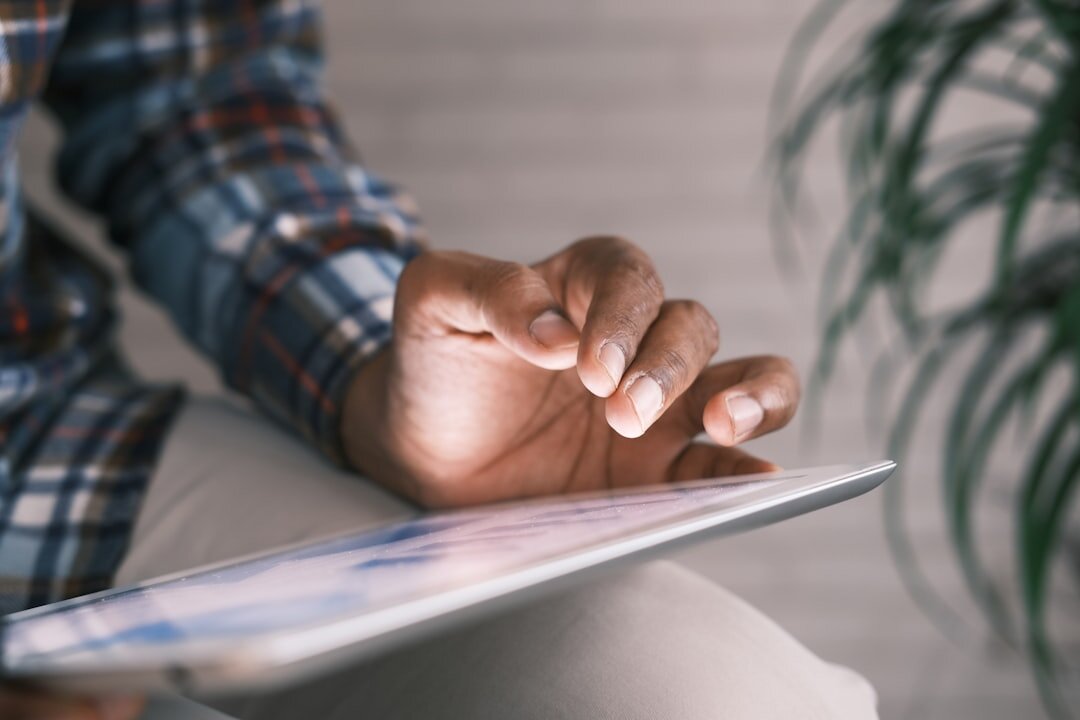 person using tablet for reading
