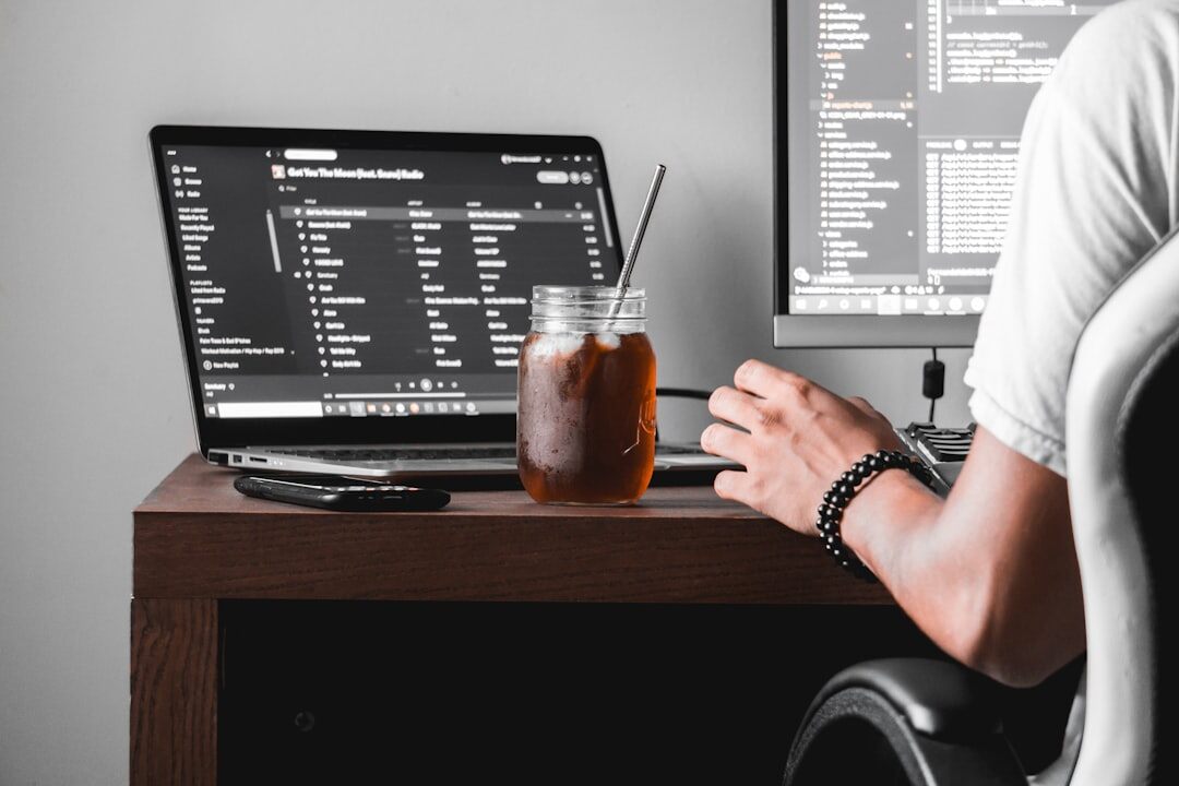programmer writing code at desk