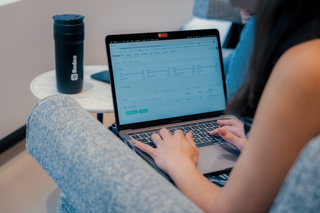 person coding on laptop